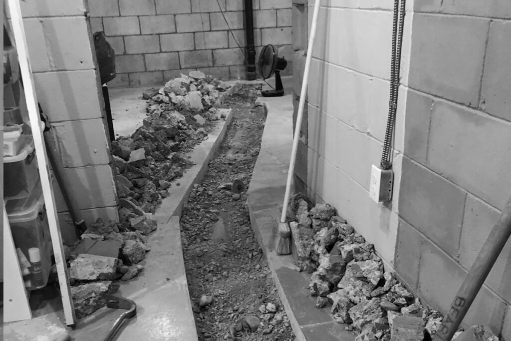 Replacing cast iron sewer lines under the basement slab
